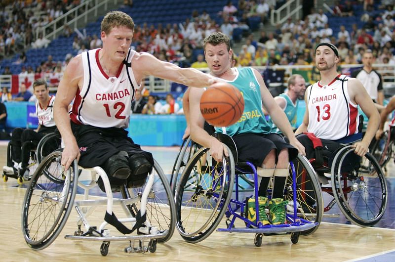 Canada&#039;s Patrick Anderson (#12) in men&#039;s Wheelchair Basketball in the 2004 Athens Paralympics