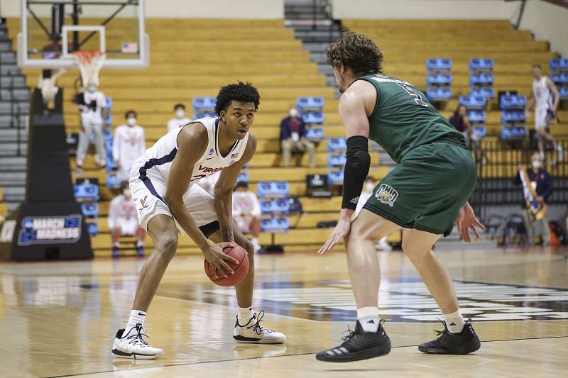 Trey Murphy III #25 handles the ball defended by Ben Vander Plas #5.