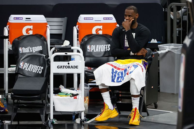 LeBron James #23 rests on the bench.