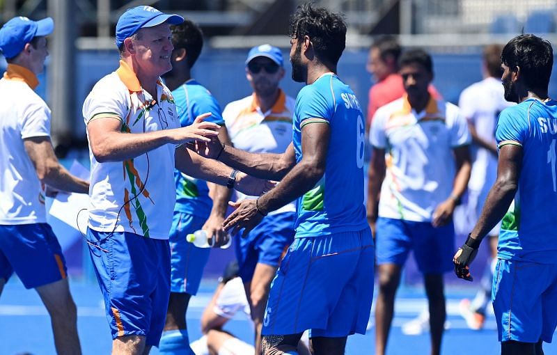 Indian men&#039;s hockey team coach Graham Reid with his players at the Tokyo Olympics.
