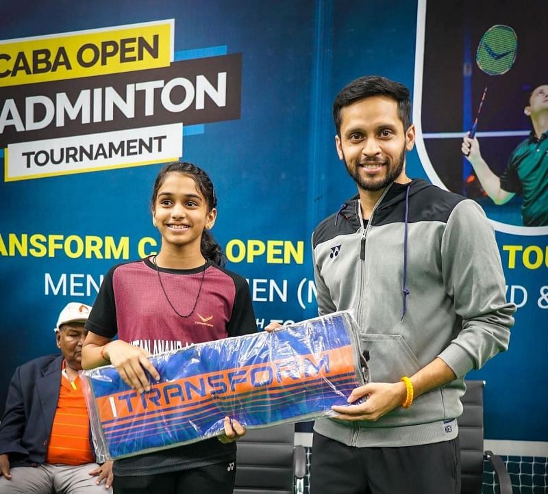 One of the winners receiving prize from Parupalli Kashyap on Monday