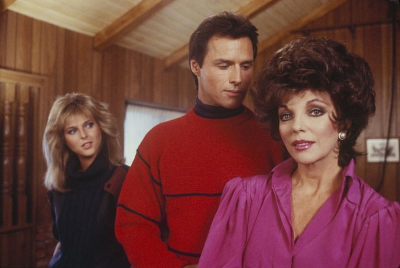 Michael Nader with Catherine Oxenberg and Joan Collins in Dynasty (Image via Getty Images)
