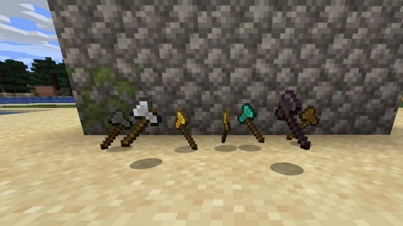 Stone, iron, wooden, diamond, golden and Netherite axes (Image via Minecraft)