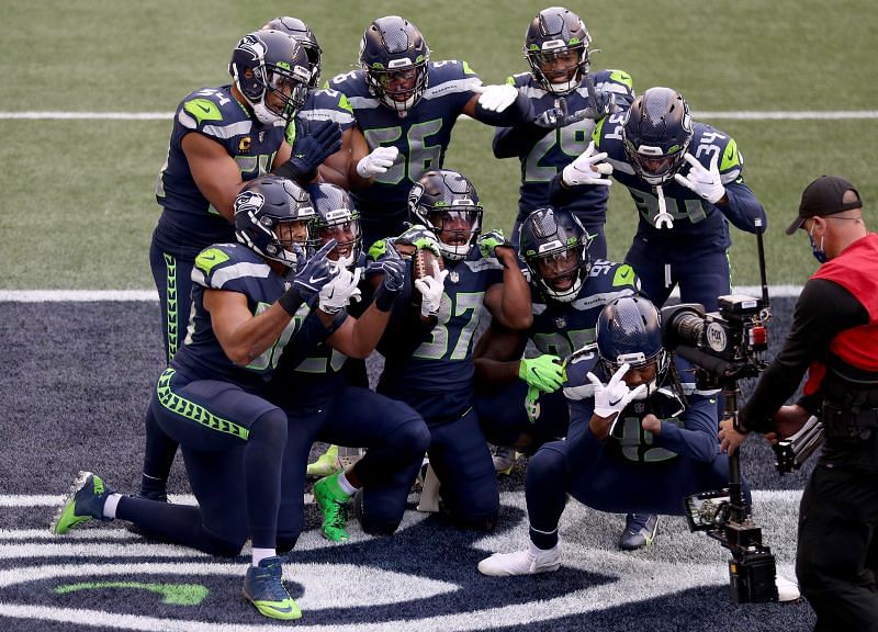 Seattle Seahawks defense celebrates in the end zone after a big play