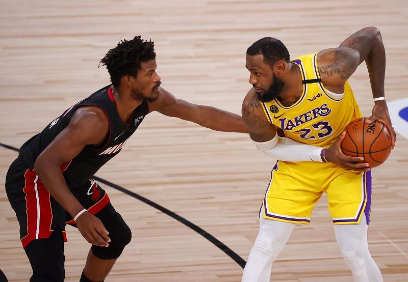 Jimmy Butler (#22) of the Miami Heat defends LeBron James (#23) of the LA Lakers