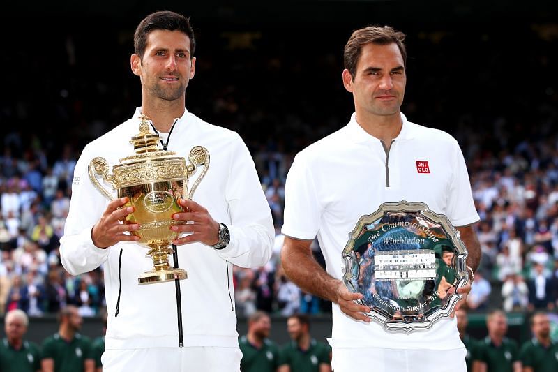 Novak Djokovic and Roger Federer with their trophies The Championships - Wimbledon 2019