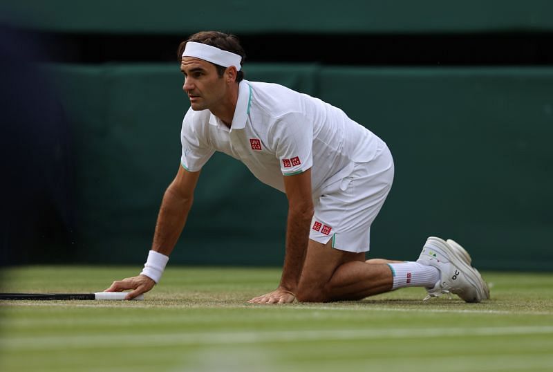 Roger Federer stumbles during his men's singles second round match against Richard Gasquet at The Championships - Wimbledon 2021 on July 01, 2021 in London, England.