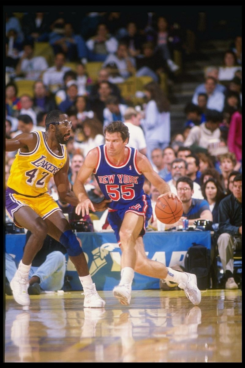 Forward Kiki Vandeweghe of the New York Knicks tries to drive the ball past forward James Worthy of the LA Lakers