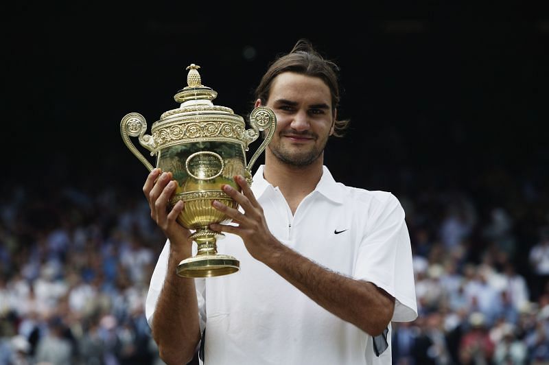 Roger Federer holds the Wimbledon 2003 trophy