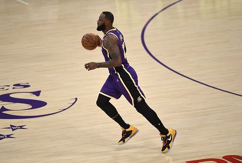 LeBron James #23 of the LA Lakers dribbles the ball after returning to the starting lineup against the Sacramento Kings at Staples Center on April 30, 2021