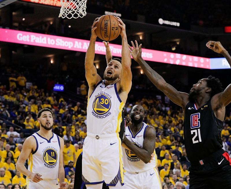 Stephen Curry of the Golden State Warriors grabs a rebound [Source: San Francisco Chronicle]