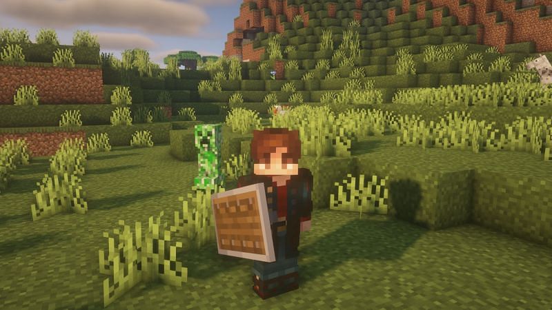 Player with a shield (Image via Minecraft)
