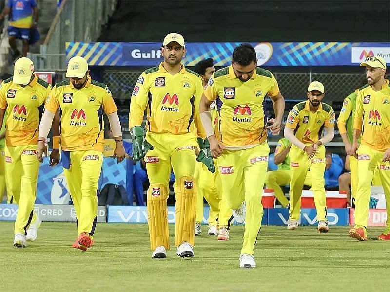 MS Dhoni leads his team into the field