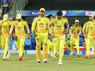 MS Dhoni leads his team into the field