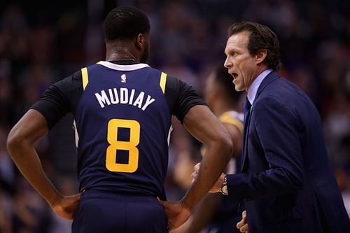 Utah Jazz coach Quin Snyder talks with Emmanuel Mudiay #8 during the first half of a game.