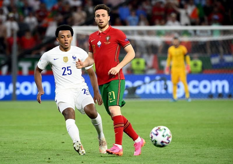 Jules Kounde (left) in action for France at Euro 2020