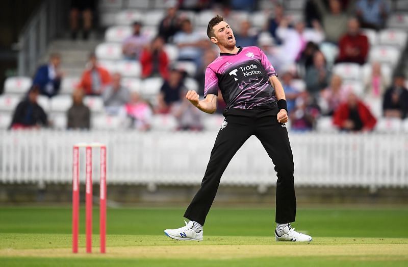 Middlesex bowler celebrates after taking a wicket