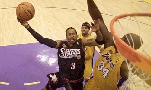 Allen Iverson fends off Shaquille O'Neal. Photo: Jeff Mitchell/AP