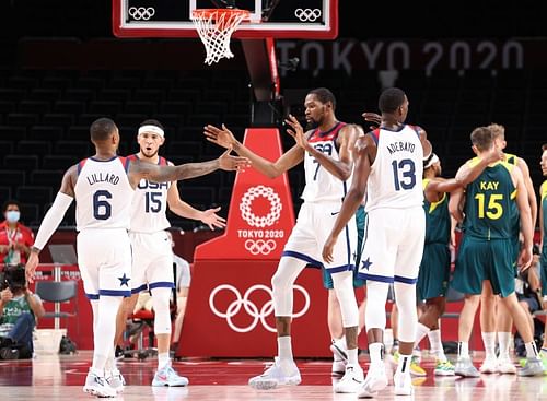 Kevin Durant #7 high-fives teammate Damian Lillard #6.