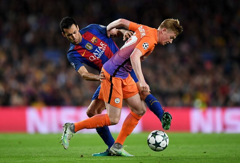 Sergio Busquets (left) in action for Barcelona