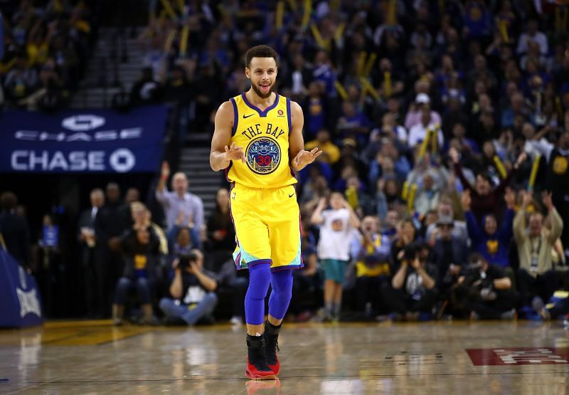 Steph Curry celeberates after scoring against theMinnesota Timberwolves