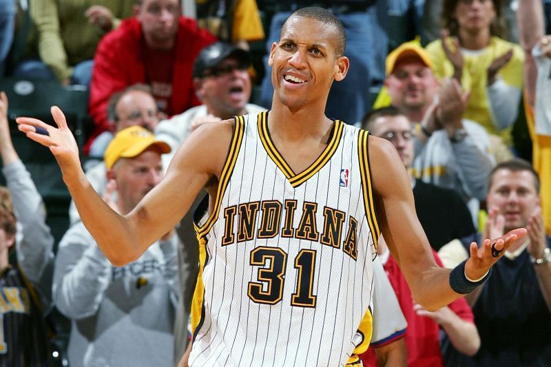 Reggie Miller puts his hands up. [Photo by Elsa/Getty Images]