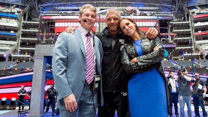 Vince McMahon with Triple H and Stephanie McMahon