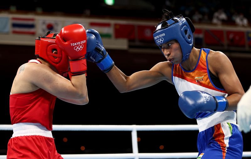 Busenaz Surmeneli (red) of Team Turkey exchanges punches with Lovlina Borgohain of Team India during the Women&#039;s Welter (64-69kg) semi final of the Tokyo 2020 Olympic Games