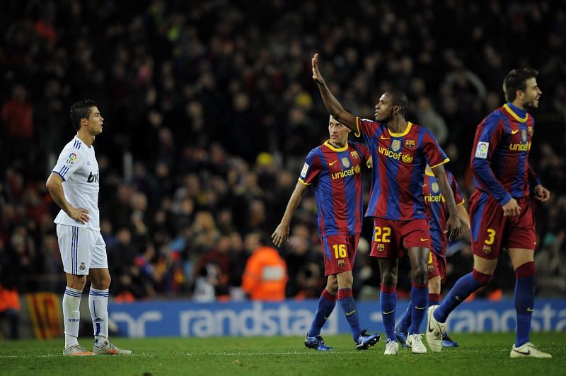 A dejected Cristiano Ronaldo is taunted by Barcelona&#039;s Eric Abidal