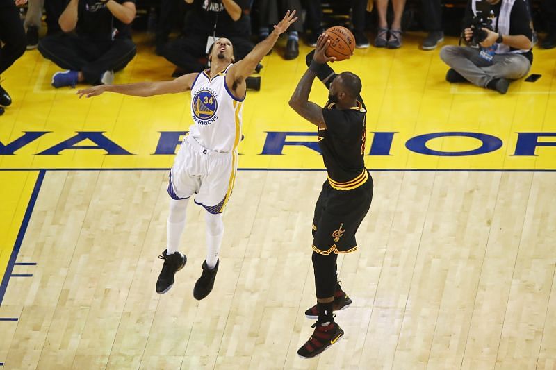 LeBron James and Shaun Livingston in action during an NBA Finals game.