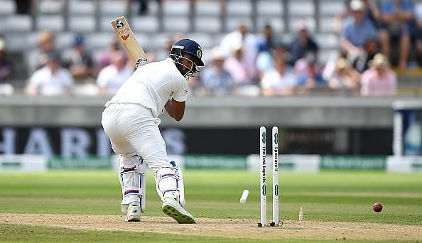 KL Rahul looks back after being bowled by Sam Curran