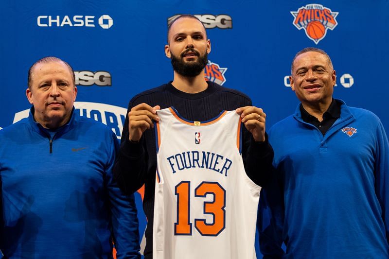 Tom Thibodeau poses with Evan Fournier #13 and general manager Scott Perry