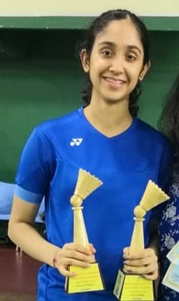Kriti Bharadwaj with her State badminton trophies