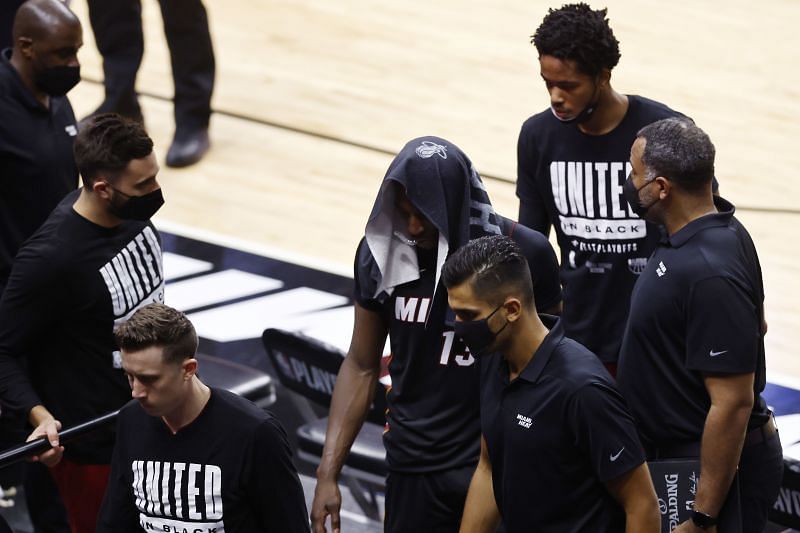 Miami Heat players leave the court dejected after losing to the Milwaukee Bucks