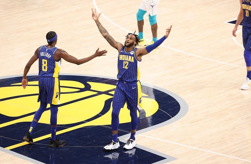 Oshae Brissett #12 celebrates against the Charlotte Hornets