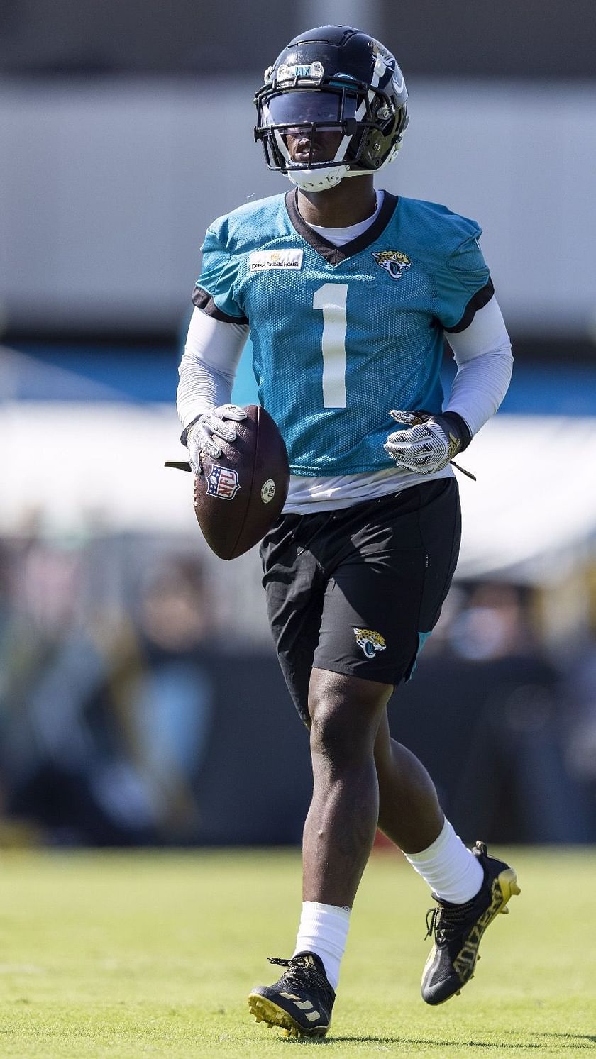 Travis Etienne Jacksonville Jaguars Unsigned Maneuvers Past