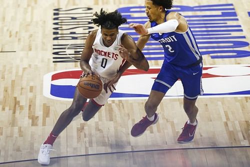 The Rockets Jalen Green drives past Pistons Cade Cunningham