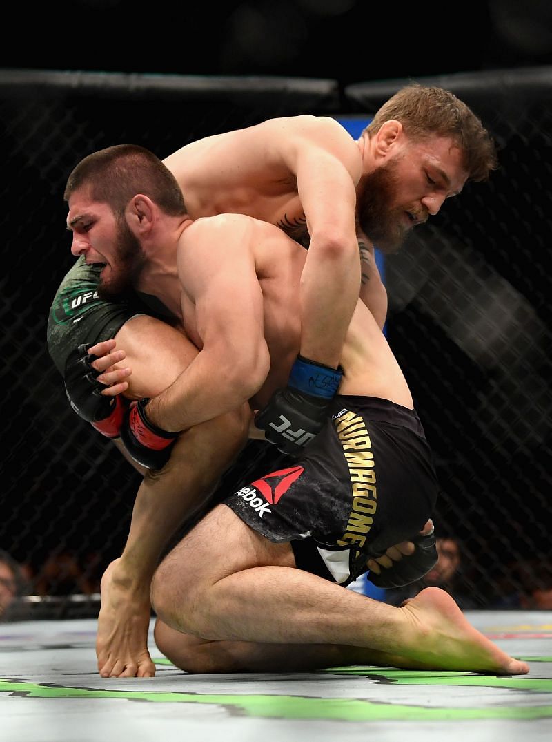 Conor McGregor grabs Khabib Nurmagomedov&#039;s trunks to prevent a takedown.