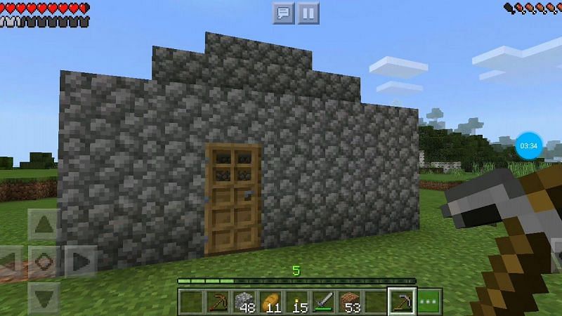 A basic cobblestone house (Image via YouTube/JustPixelPlays)