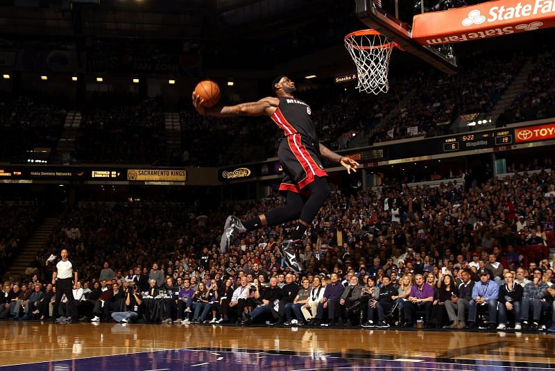 LeBron James in the middle of executing his signature dunk