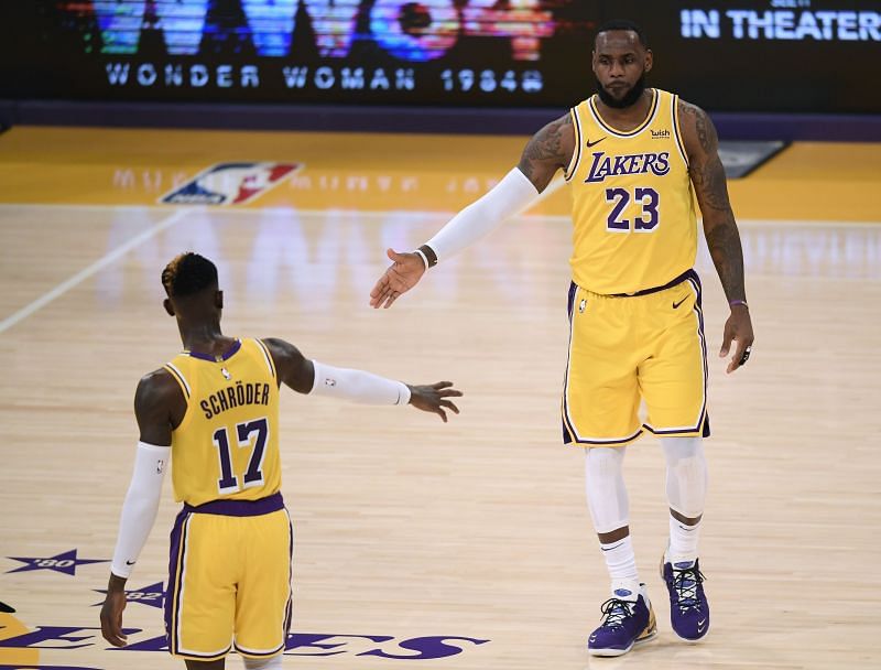 The LA Lakers&#039; LeBron James #23 celebrates a play with Dennis Schroder #17