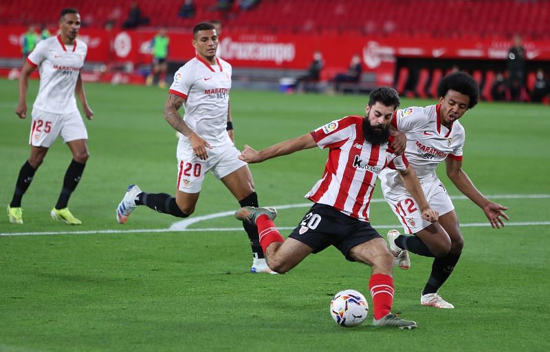 Jules Kounde (right) in action for Sevilla