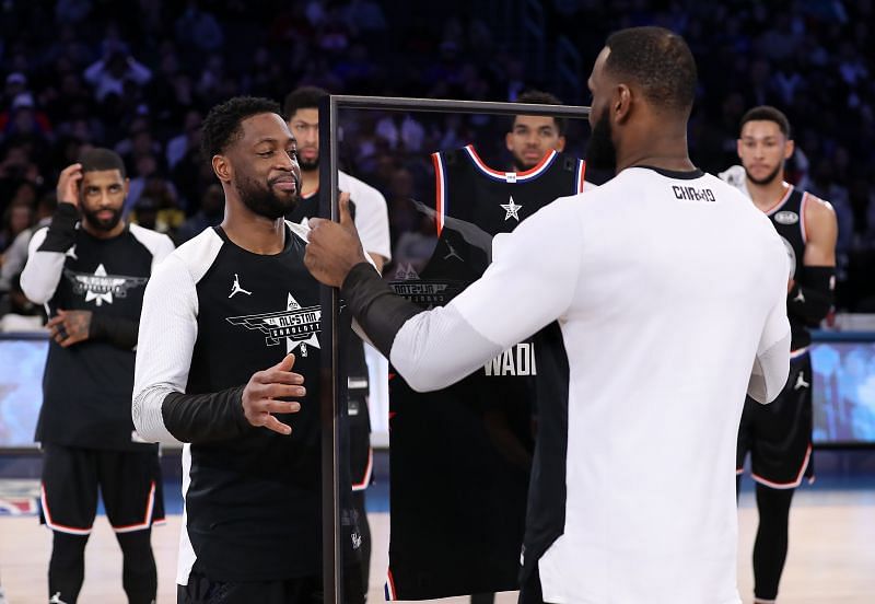 LeBron James congratulates Dwyane Wade (left) with a momento in his last NBA All-Star game appearance.