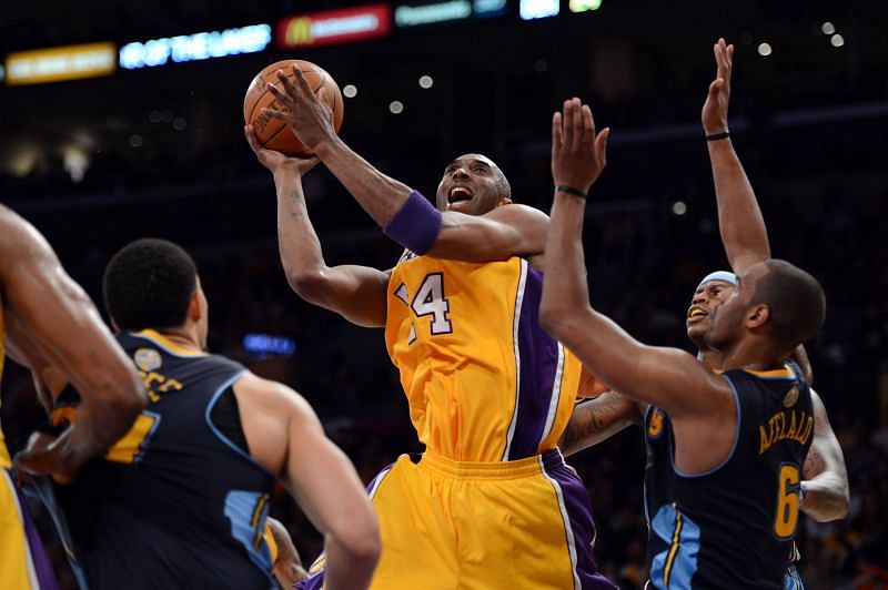 Kobe Bryant #24 goes up for a shot over Arron Afflalo #6.