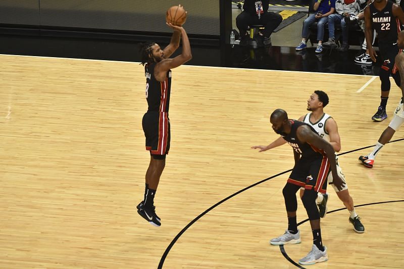 Trevor Ariza #8 attempts a three-point shot in the first half against the Milwaukee Bucks.