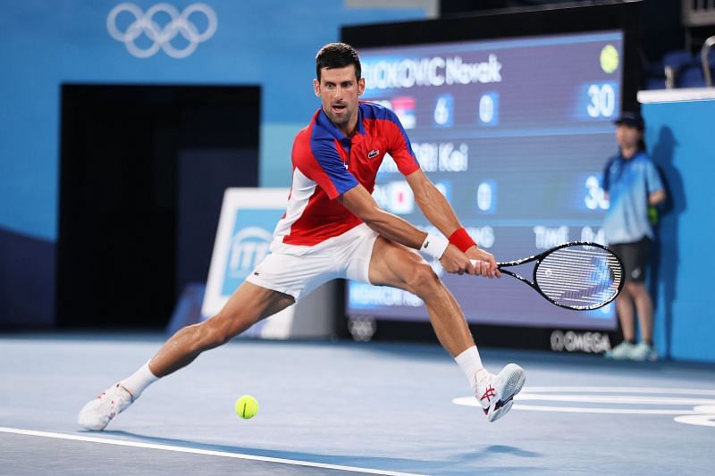 Novak Djokovic stretching to reach a shot