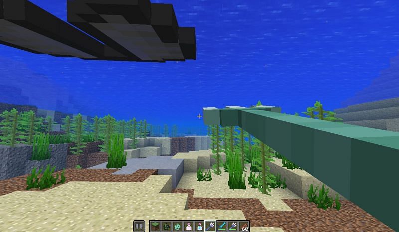 Preparing to use the riptide enchantment underwater (Image via Minecraft)
