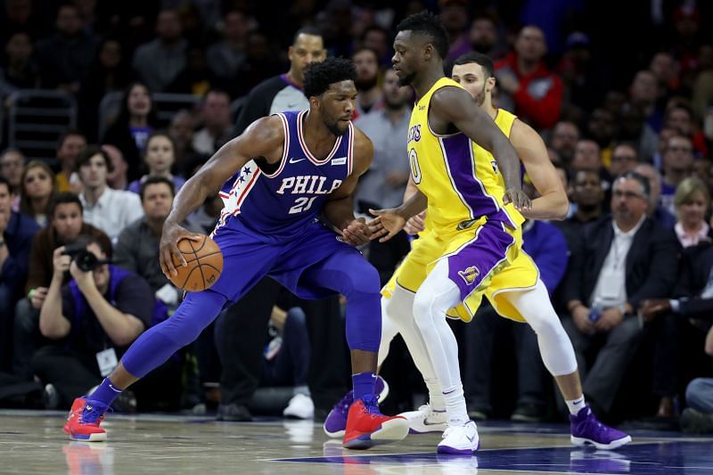 Joel Embiid #21 of the Philadelphia 76ers drives to the basket against Julius Randle #30 of the Los Angeles Lakers