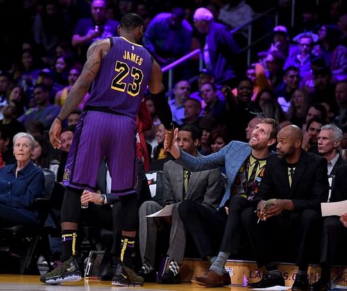 LeBron James (#23) shakes hands with Dirk Nowitzki.