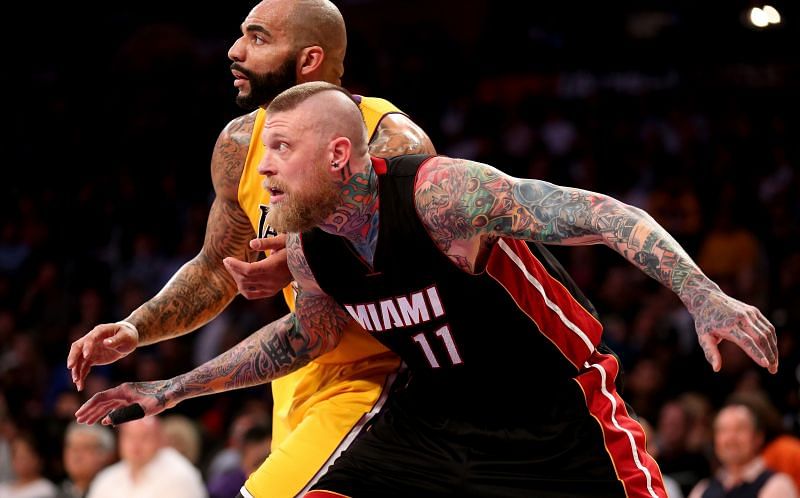 Chris Andersen (#11) fights for position against Carlos Boozer (#5).